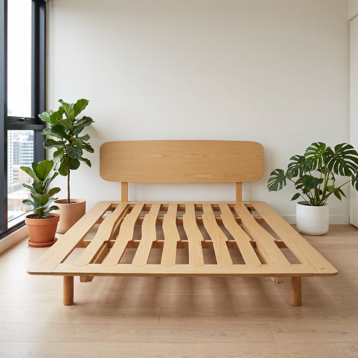 AVONEST bed frame in a Melbourne apartment with city skyline view